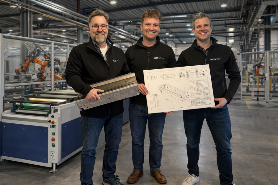 The ecodry team with technical drawing in industrial environment